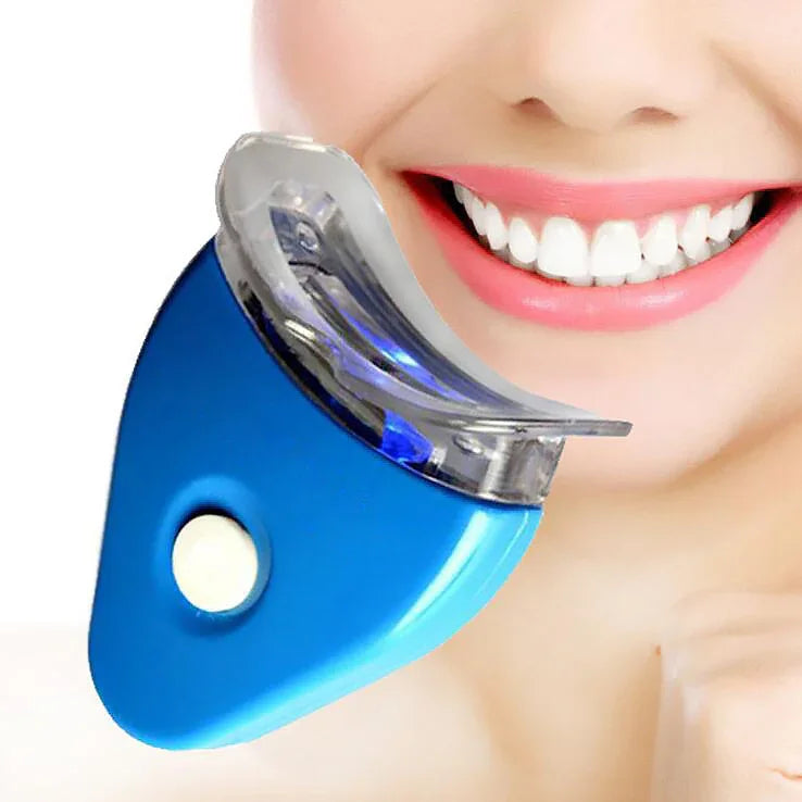 Person using a blue LED teeth whitening mouthpiece for dental care