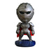 Futuristic silver armored figure with black visor, metallic suit, red cape, and blue base