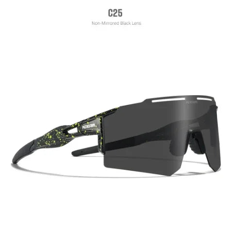 Futuristic black sunglasses with non-mirrored lenses and green splatter detail, sporty fit.
