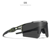 Futuristic black sunglasses with non-mirrored lenses and green splatter detail, sporty fit.