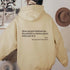 Oversized beige hoodie with inspirational text on back, casual relaxed fit streetwear