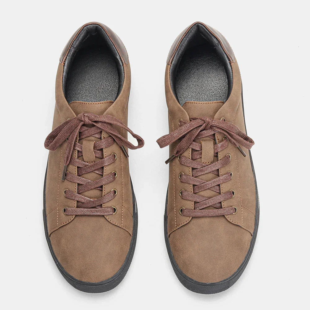 Brown suede low-top sneakers with matching laces, black rubber soles, casual fit