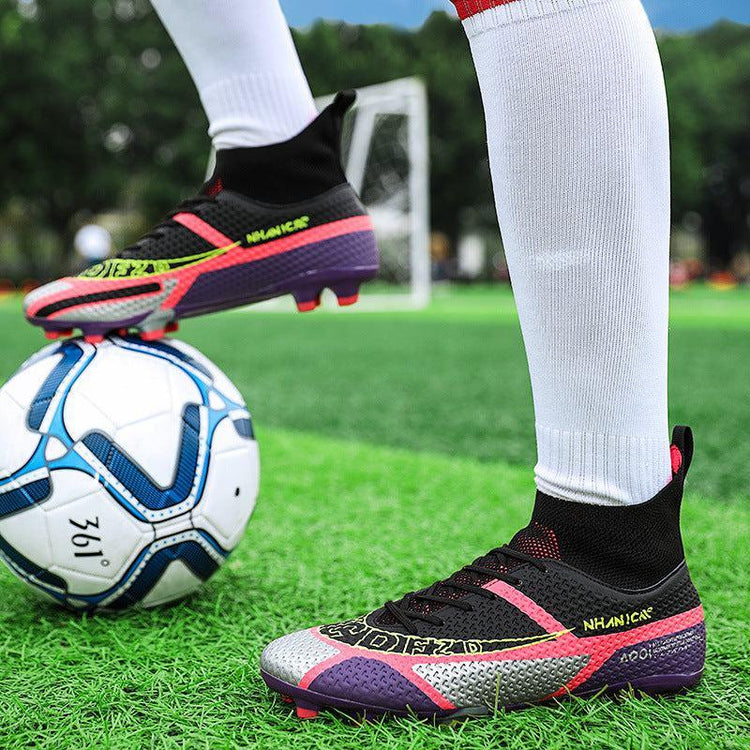 Colorful synthetic soccer cleats with sock-like ankle fit, worn with white socks on green turf