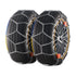 Two black car tires with metal snow chains, close-up on tread and chain detail.