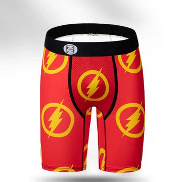 Red compression shorts with yellow lightning bolt print, sporty fit, breathable material.