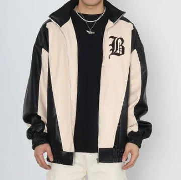 Men's oversized beige and black colorblock track jacket with bold letter detail, relaxed fit