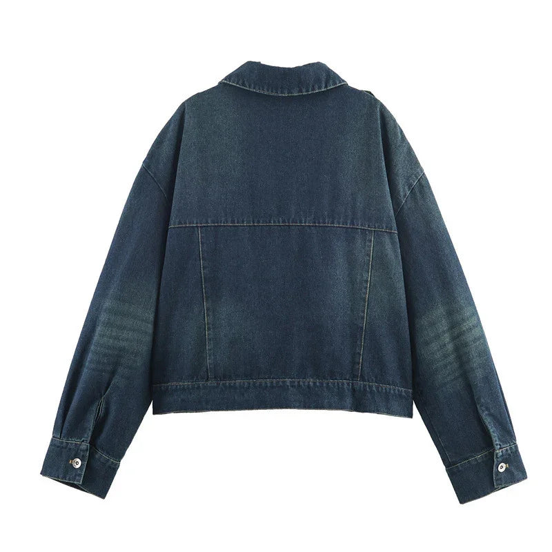 Back view of dark blue denim jacket with long sleeves and relaxed fit