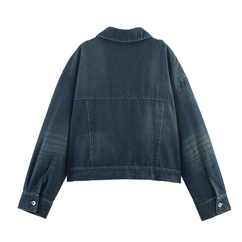 Back view of dark blue denim jacket with long sleeves and relaxed fit