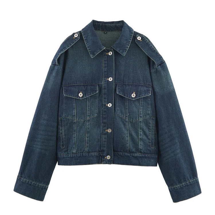 Dark blue denim jacket with button front, oversized fit, chest flap pockets, and shoulder epaulets