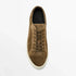 Brown suede low-top sneaker with lace-up front and white rubber sole on white background