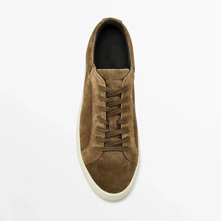 Brown suede low-top sneaker with lace-up front and white rubber sole on white background
