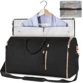 Black duffel garment bag with gold zippers, detachable strap, and lavender blazer inside