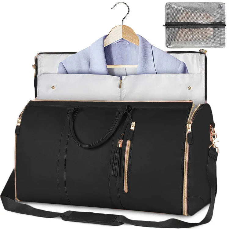 Black duffel garment bag with gold zippers, detachable strap, and lavender blazer inside
