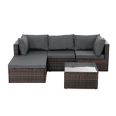 Modern outdoor sectional sofa set with dark wicker frame and gray cushions, glass-top table