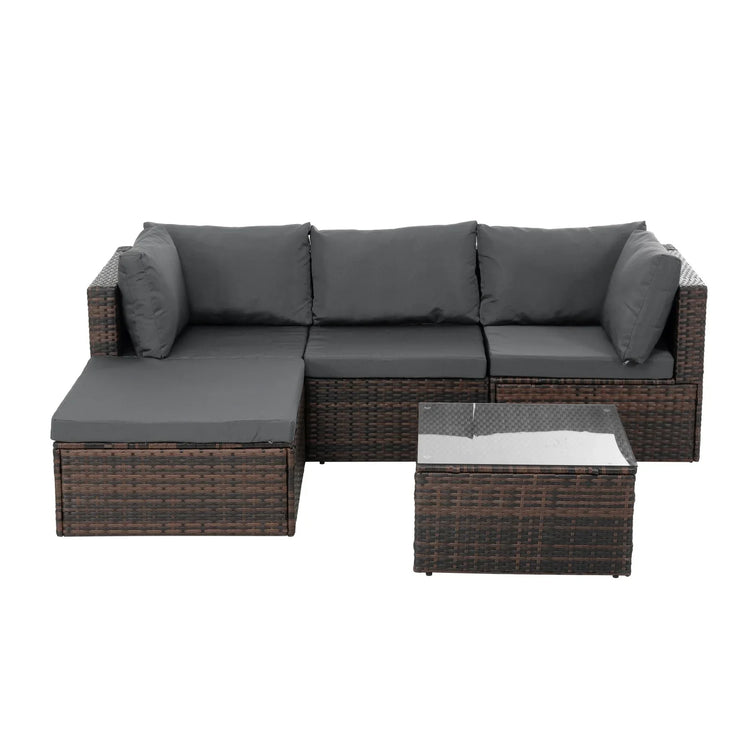 Modern outdoor sectional sofa set with dark wicker frame and gray cushions, glass-top table