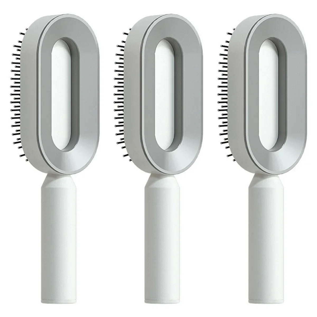 Three modern grey and white oval hair brushes with ergonomic handles and plastic bristles.