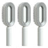Three modern grey and white oval hair brushes with ergonomic handles and plastic bristles.
