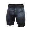 Black and gray men's compression gym shorts with textured pattern, elastic waistband, designed for activewear and athletic training