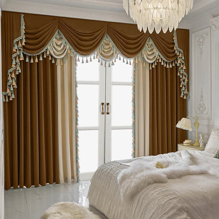 Elegant brown and cream velvet drapes with tassel trim in a luxury bedroom
