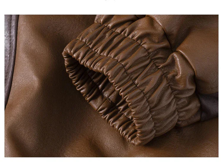 Brown faux leather jacket sleeve with elastic cuff, close-up detail of material and fit