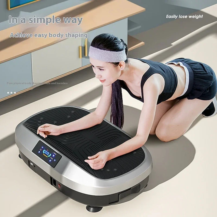 Woman in black athletic crop top and shorts kneeling on vibration plate, fitness apparel