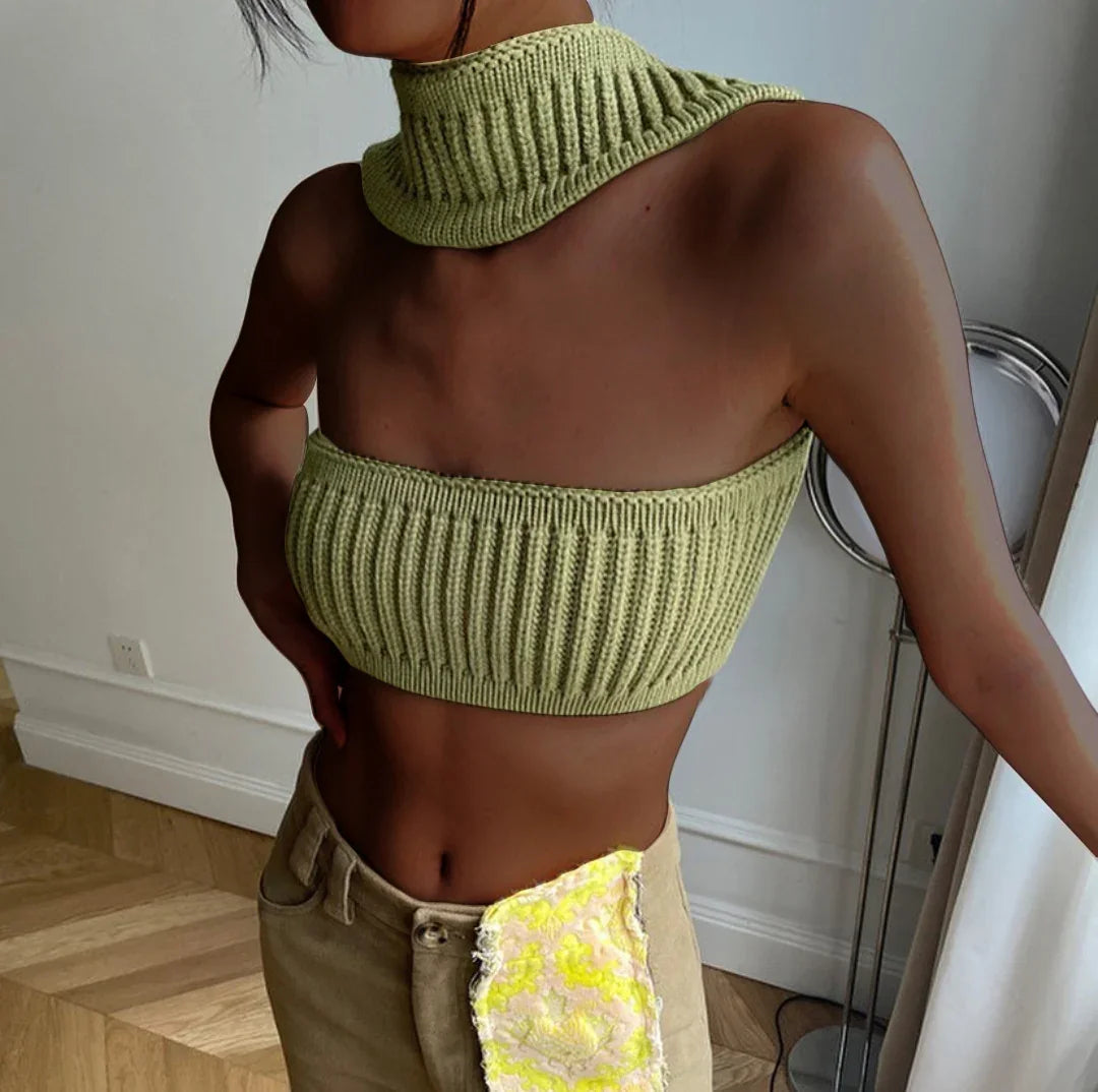 Woman wearing a light green ribbed knit crop top and scarf set with a slim fit.