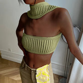 Woman wearing a light green ribbed knit crop top and scarf set with a slim fit.