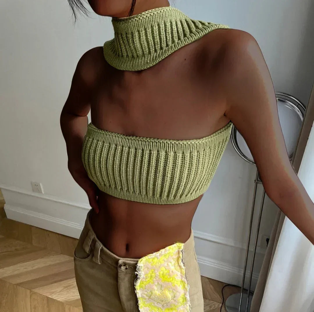 Woman wearing a light green ribbed knit crop top and scarf set with a slim fit.