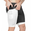 Black and white tech shorts with secure phone pocket, slim fit, stretch fabric for active wear