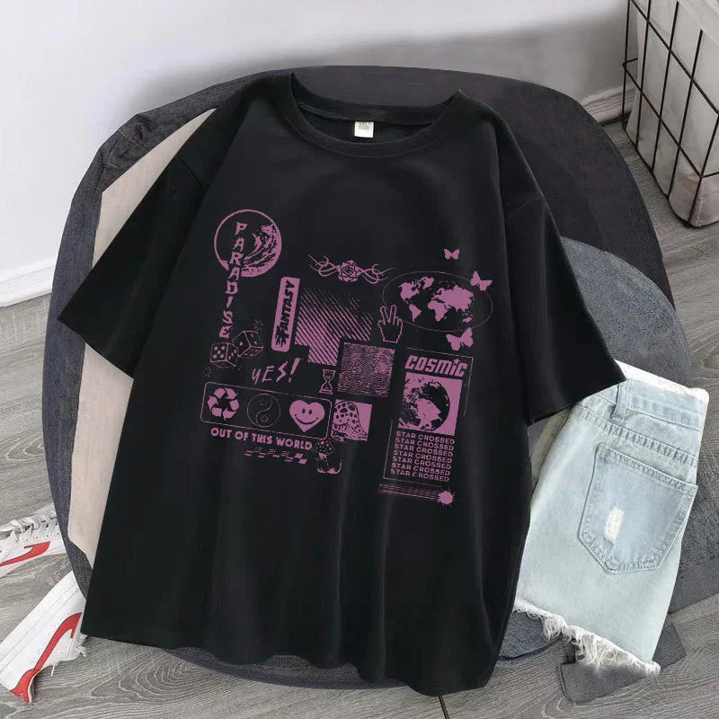 Black oversized graphic t-shirt with purple futuristic prints, paired with light denim shorts
