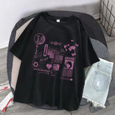 Black oversized graphic t-shirt with purple futuristic prints, paired with light denim shorts