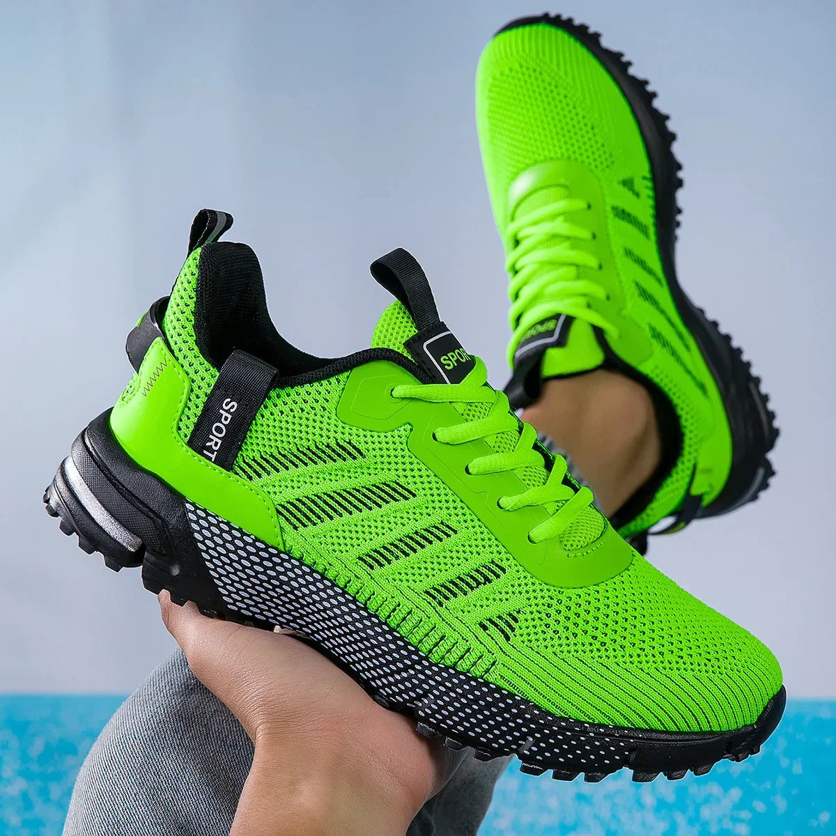 Neon green mesh sneakers with chunky black soles and sporty lace-up design, breathable fit