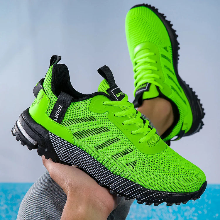 Neon green mesh sneakers with chunky black soles and sporty lace-up design, breathable fit