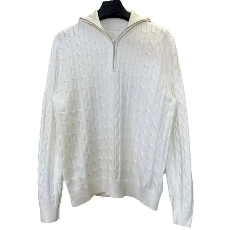 White cable knit pullover sweater with a half-zip collar, relaxed fit, ribbed cuffs and hem.