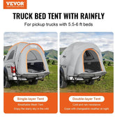 Gray and orange truck bed tents with mesh window and rainfly, set up on pickup trucks outdoors