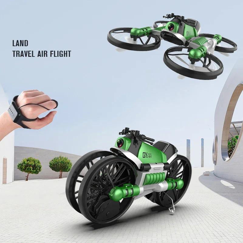 Green and black futuristic toy vehicle shown in car mode on ground and drone mode in air, remote controlled by hand gesture device.