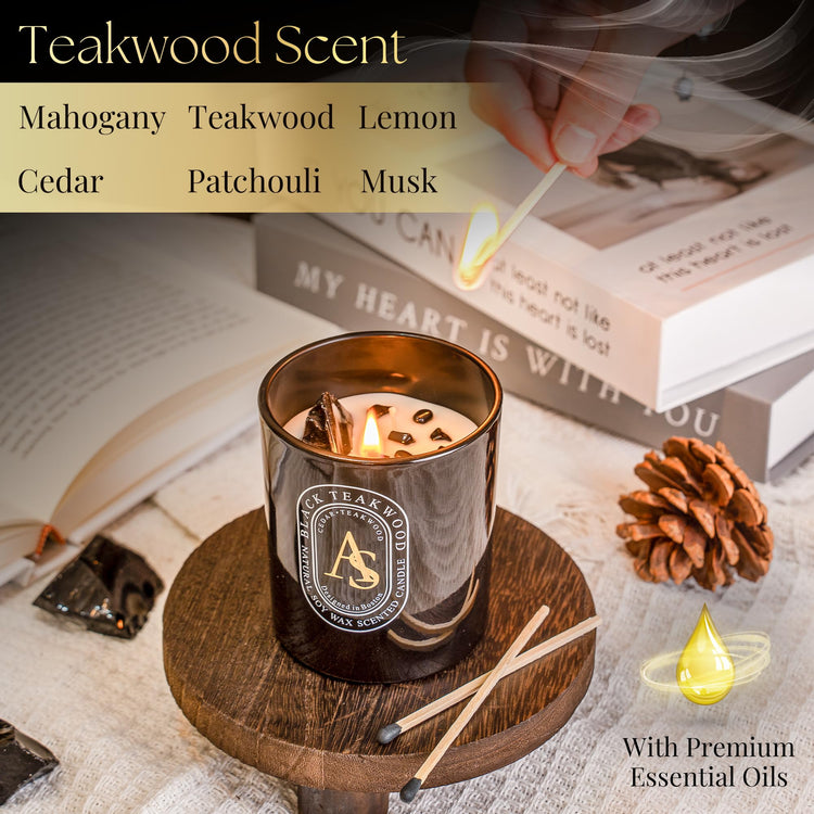 Scented candle for men with teakwood mahogany cedar musk patchouli lemon fragrance and obsidian bracelet in black glass jar on wooden coaster