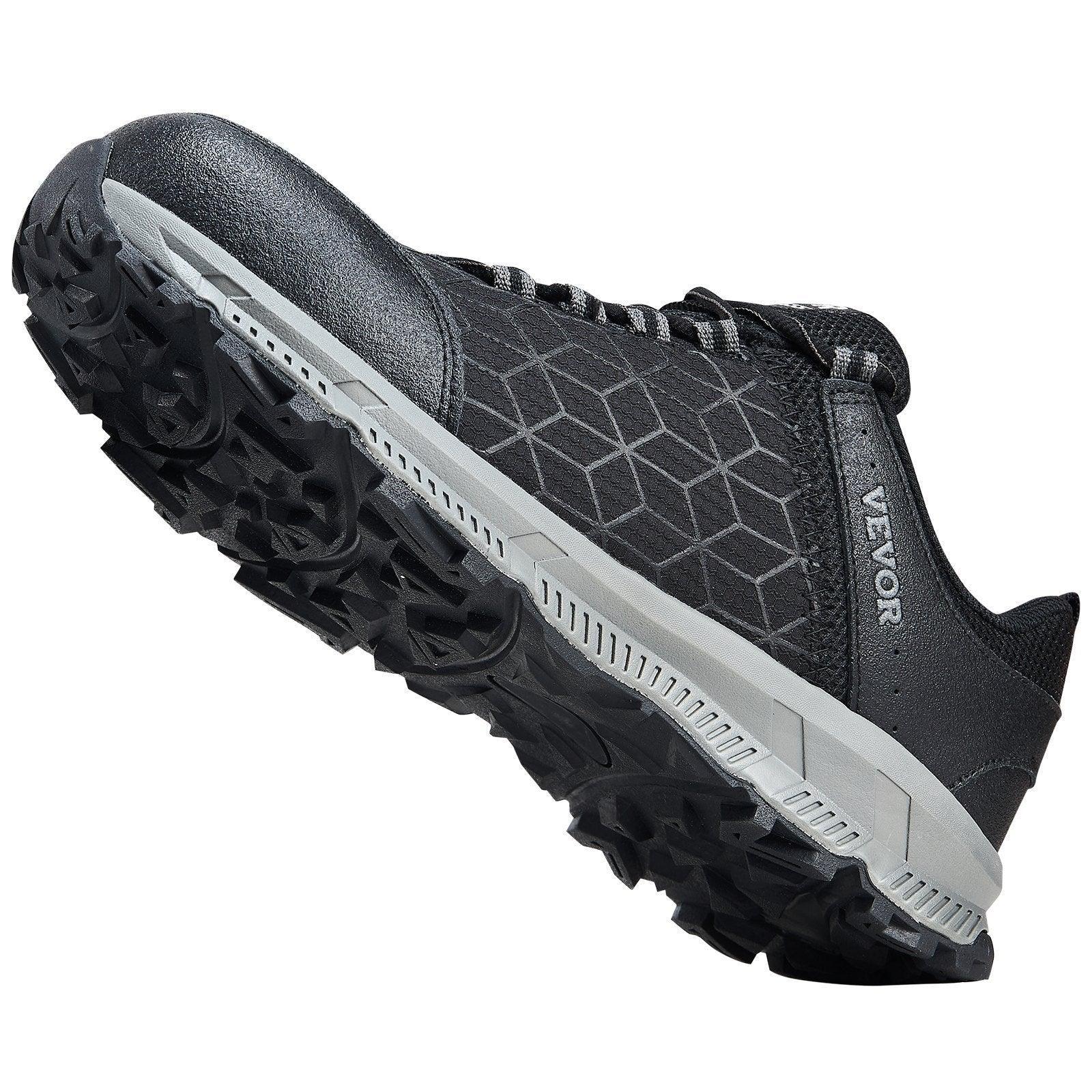 Black low-top sneaker with geometric mesh pattern, rugged non-slip sole, and lace-up design