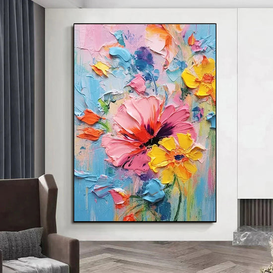 Colorful abstract floral painting with bold pink, yellow, and orange textured flowers on canvas.