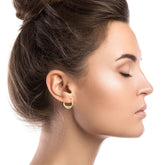 14K gold solid tricolor diamond cut heart hoop earrings worn by woman