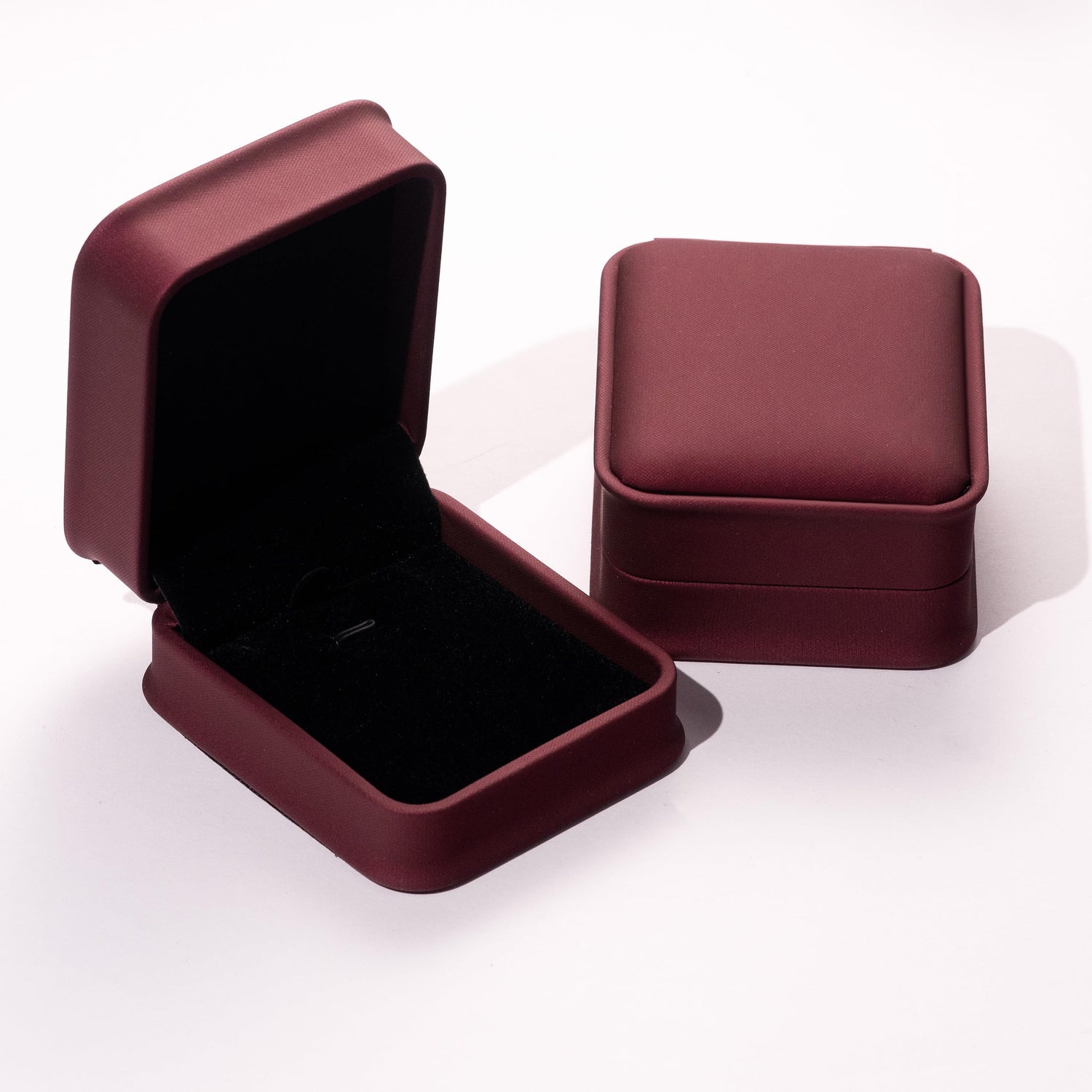 open burgundy jewelry box for 14K gold necklaces with velvet interior
