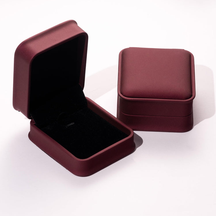 open burgundy jewelry box for 14K gold necklaces with velvet interior