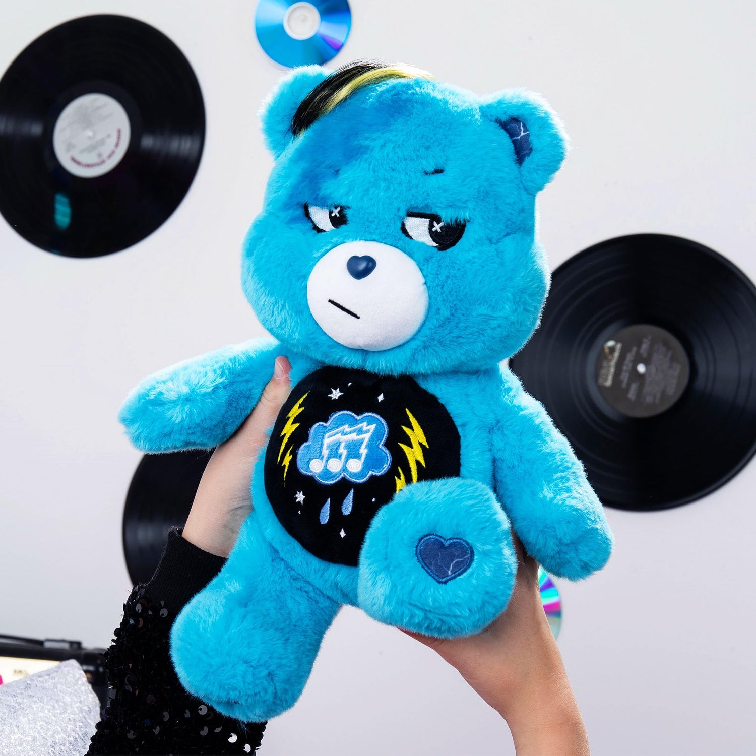 Rock-a-Lot Grumpy Bear 14-inch blue plush with musical belly badge and lightning paw prints