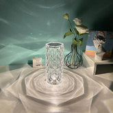 Crystal clear geometric glass vase reflecting light on tabletop, minimal modern decor