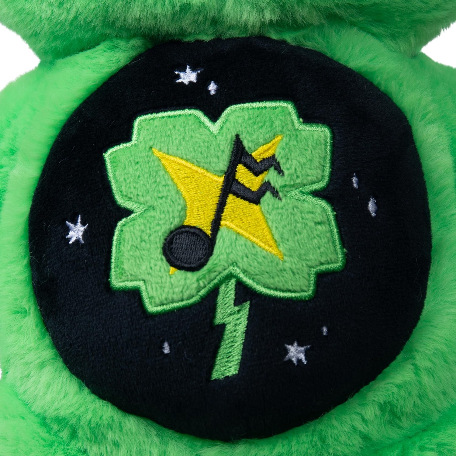 14 inch green Care Bears Rock-a-Lot Good Luck Bear plush with musical four-leaf clover belly badge and star accents