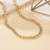 14K gold Cuban link chain necklace with chunky design and engraved patterns, available in multiple lengths for women and men