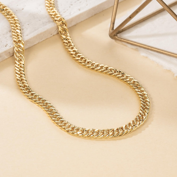14K gold Cuban link chain necklace with chunky design and engraved patterns, available in multiple lengths for women and men
