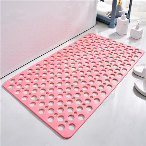 Pink non-slip bath mat with circular holes, soft rubber material, rectangular shape