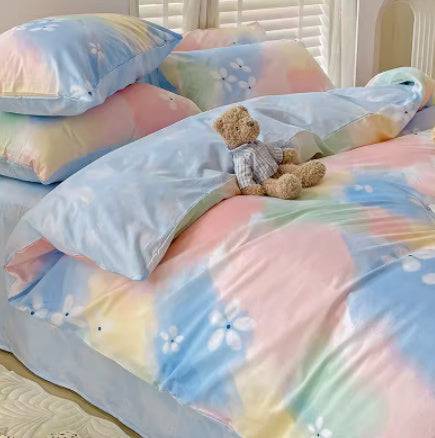 Gradient color bed set with cotton fabric and pastel tones featuring floral patterns and plush toy on bed
