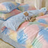 Gradient color bed set with cotton fabric and pastel tones featuring floral patterns and plush toy on bed